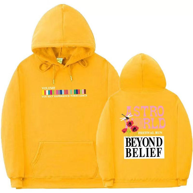 Yellow streetwear hoodie with colorful text and graphics, featuring long sleeves and a hood.