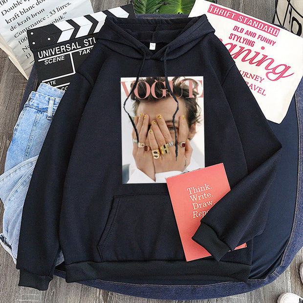 Large Harajuku style ladies pullover hoodie with Vogue print on black fabric.