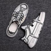 Wild white sneakers men's breathable mesh casual shoes on dark background.