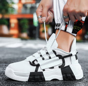 Platform sneakers with front strap and breathable mesh inner material.