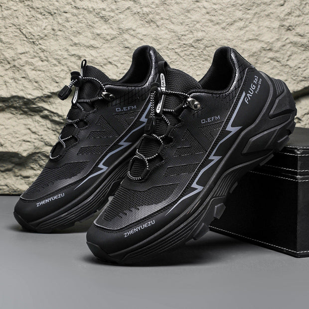 Men's black colorblock sneakers with lace-up design for outdoor activities.