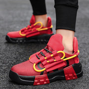 Platform sneakers with red upper, front strap design, and breathable mesh material, worn outdoors.