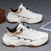 Men's colorblock sneakers with white and brown design, flat heel, rubber sole, and lace-up style for outdoor and sports activities.
