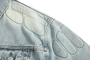 Blue denim jacket with quilted patches on the shoulder, made for men with a skull design theme.