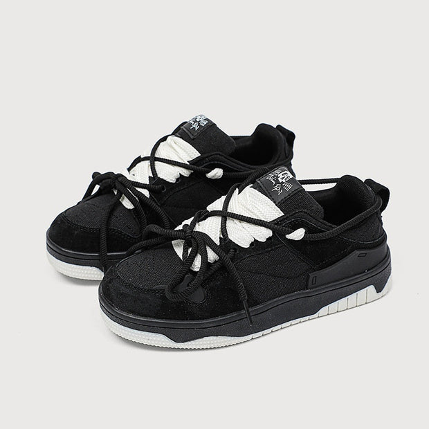 Retro heavy industry sneakers in black, featuring mesh lining, flat heel, and cross shoulder strap elements.