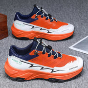 Men's colorblock sneakers with orange, white, and blue design, flat heel, and front lace-up style for outdoor sports.