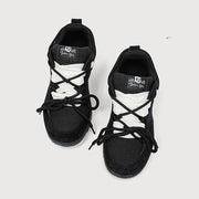 Retro heavy industry women's casual sneakers in black with cross shoulder straps and flat heel.