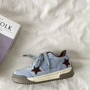 Retro platform star pattern women's casual sneaker in blue suede with thick rubber sole.