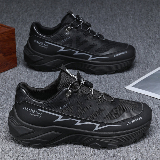 Men's colorblock sneakers in black for outdoor activities, featuring a flat heel and lace-up design, ideal for hiking and running.