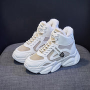 Women's fleece-lined high top sneakers with lace-up design and rubber sole.