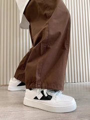 Casual sneakers in white with leather stitching and front lace-up design.