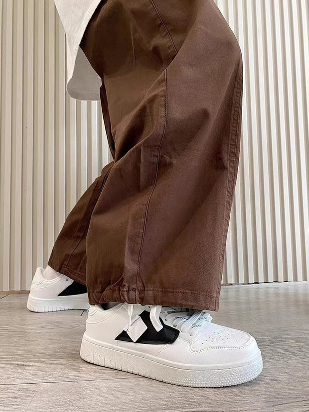 Casual sneakers in white with leather stitching and front lace-up design.