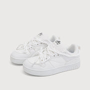 Retro heavy industry white sneakers for women with flat heel and mesh lining.